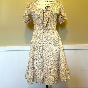 SHE & SKY- floral medium dress, has tie around chest that has open area. EUC